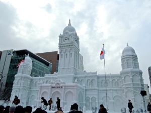 Sapporo Snow Festival, Hokkaido. An entire street was laid out with the most elaborate snow sculptures found anywhere. This was one of the biggest, just incredible to see that much snow made into what looks like a real building!